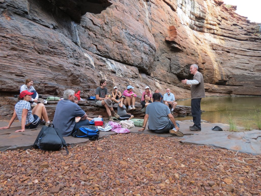 A guide leading a group of people in Karijini National Park